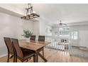 Bright dining area with a wood table and four chairs at 12035 Leyden St, Brighton, CO 80602