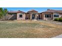 Charming front exterior with stone accents, manicured lawn, and a welcoming entrance at 2102 Shoreside Dr, Berthoud, CO 80513