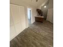 Open-concept living room with vaulted ceiling, hardwood floors, neutral paint, and lots of natural light at 4876 E Kentucky Ave # F, Denver, CO 80246