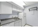 Functional kitchen features granite countertops, modern appliances, and ample cabinet space at 1020 15Th St # 25D, Denver, CO 80202