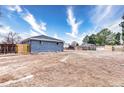 Spacious backyard with potential for landscaping, partially fenced with a mix of wood and metal at 11367 Fowler, Northglenn, CO 80233