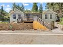 Inviting home showcasing a stone wall, deck and steps, offering great curb appeal at 55 Two Moon Rd, Idaho Springs, CO 80452