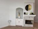 Bright living room with hardwood floors, built in nook and fireplace at 1896 S Marshall Cir, Lakewood, CO 80232