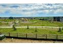 Scenic view of backyard including walking path and playground from the property at 13358 Blue Amber Ct, Parker, CO 80134