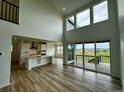 Open-concept living room showcasing a spacious floor plan and abundant natural light at 13358 Blue Amber Ct, Parker, CO 80134