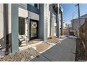 Inviting front entrance featuring a stylish black door, modern exterior details, and a welcoming entryway at 2790 W 25Th Ave # 6, Denver, CO 80211