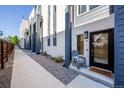 Inviting front porch with a cozy chair and stylish front door at 2790 W 25Th Ave # 6, Denver, CO 80211