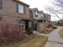 Attractive townhomes with brick and siding exteriors, private patios, and sidewalk access at 559 Alton Way # C, Denver, CO 80230