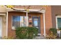 Inviting entrance featuring address, window, and covered porch at 9108 E Lehigh Ave, Denver, CO 80237