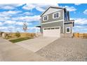 Charming two-story home featuring a two-car garage and neutral siding at 17949 Dandy Brush Ln, Parker, CO 80134