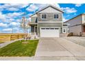 Charming two-story home featuring a two-car garage and neutral siding at 17949 Dandy Brush Ln, Parker, CO 80134