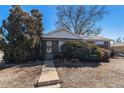 Single-story brick home with tidy front yard landscaping at 7232 Kalamath St, Denver, CO 80221