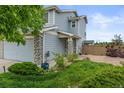 Charming two-story home with stone accents, a well-maintained lawn, and a delightful curb appeal for lasting impressions at 5864 Turnstone Pl, Castle Rock, CO 80104