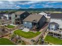 This home has a large backyard featuring a wooden deck and mountain views at 8132 Mt Harvard Rd, Littleton, CO 80125