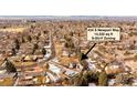 A captivating aerial view highlights the home's pool and landscaping on a large lot at 434 S Newport Way at 434 S Newport Way, Denver, CO 80224