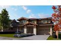 Two-story home with stone and wood exterior, attached garage, and landscaping at 1020 24Th St, Golden, CO 80401