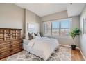Spacious bedroom with hardwood floors and ample natural light at 1950 N Logan St # 807, Denver, CO 80203