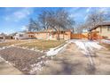 Brick Ranch home with a gravel driveway and a spacious yard at 7505 Clay St, Westminster, CO 80030