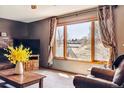 Comfortable living room boasts natural light, large windows, and a cozy atmosphere at 1479 S Jasper St, Aurora, CO 80017