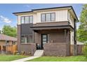 Inviting two-story house featuring a classic brick design and contemporary accents at 1373 S Garfield St, Denver, CO 80210