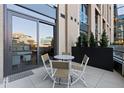 Private patio with a table and seating for entertaining or relaxing at 1901 Wazee St # 312, Denver, CO 80202