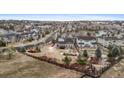 An elevated street view of home's backyard and other homes in the surrounding neighborhood at 24608 E Moraine Pl, Aurora, CO 80016