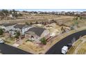 Aerial view of a residential home showcasing a landscaped backyard and a peaceful neighborhood setting at 24608 E Moraine Pl, Aurora, CO 80016
