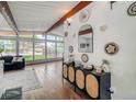 Spacious living room features hardwood floors, large windows, and stylish decor, offering ample natural light at 450 Yukon St, Lakewood, CO 80226