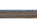 Expansive flat land surrounding the property, offering a sense of privacy and open space at 56315 E 74Th Ave, Strasburg, CO 80136