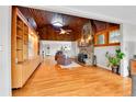 Open-concept living room with vaulted wood ceilings and fireplace at 350 Tower Hill Cir, Golden, CO 80401