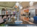 Modern bar area featuring sleek countertops, a beer tap, and stainless steel appliances at 2000 Arapahoe St # 1, Denver, CO 80205
