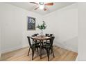 Small dining area with four chairs and wood floors at 14652 E 2Nd Ave # 202D, Aurora, CO 80011