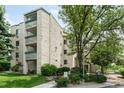 Beautiful exterior view of condo building featuring balconies, landscaping and reserved parking at 7780 W 38Th Ave # 203, Wheat Ridge, CO 80033