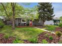 Inviting single-story home featuring a small front porch and lush green lawn at 1343 Gay St, Longmont, CO 80501