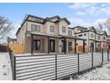 Beautiful home featuring a metal fence, covered porch, and clean modern lines at 2520 S Cherokee St, Denver, CO 80223