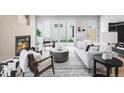 Bright living room features a modern fireplace, stylish furniture, and seamless indoor-outdoor flow at 2520 S Cherokee St, Denver, CO 80223