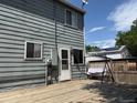 Relax on the backyard wooden deck of this inviting home, perfect for outdoor entertaining and enjoying sunny days at 10050 Holland Ct, Broomfield, CO 80021