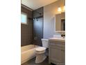 Modern bathroom featuring a tiled shower, updated fixtures, and a stylish vanity, perfect for a refreshing experience at 10050 Holland Ct, Broomfield, CO 80021