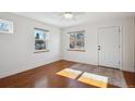 Light-filled entryway with hardwood floors and neutral walls at 3044 Eudora St, Denver, CO 80207