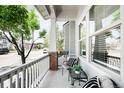 Inviting front porch with cozy seating and views of the neighborhood at 5450 Uinta St, Denver, CO 80238