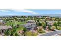 Beautiful two-story home with a stone facade, manicured lawn and a gorgeous mountain view at 6635 Tremolite Dr, Castle Rock, CO 80108