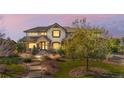 Charming two-story home with landscaped yard and walkway, perfect for families or anyone seeking a tranquil setting at 6635 Tremolite Dr, Castle Rock, CO 80108
