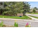 Community entrance featuring the Reflections sign and tulips at 10102 W Ida Ave # 214, Littleton, CO 80127