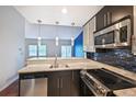 Updated kitchen featuring stainless steel appliances and modern finishes at 1829 S Union Blvd, Lakewood, CO 80228