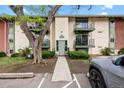 Apartment complex entrance with well-maintained landscaping and a secure entry system at 12142 Melody Dr # 301, Denver, CO 80234
