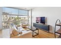 Cozy living room features modern furniture and large windows, perfect for relaxation at 2958 Syracuse St # 316, Denver, CO 80238