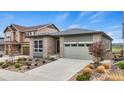 Inviting single Gathering home featuring a landscaped front yard and an attached garage at 9130 Fraser River, Littleton, CO 80125