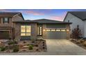 Warm, single Gathering home with a manicured front yard and a convenient two-car garage at 9130 Fraser River, Littleton, CO 80125
