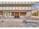 Building entrance with stone landscaping, a brick facade, and stairs leading to the door at 1090 N Lafayette St # 504, Denver, CO 80218