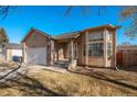 Ranch-style home with a two-car garage and neat landscaping at 302 Linden St, Frederick, CO 80530